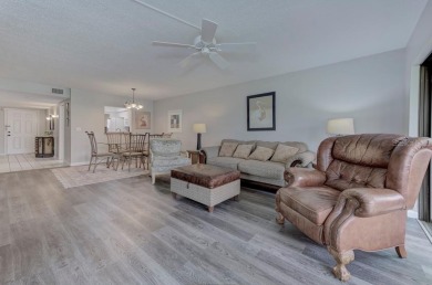 Rare First-Floor 3-Bedroom Corner Condo with Golf Course Views - on University Park Country Club in Florida - for sale on GolfHomes.com, golf home, golf lot