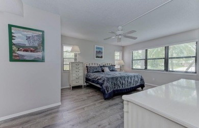 Rare First-Floor 3-Bedroom Corner Condo with Golf Course Views - on University Park Country Club in Florida - for sale on GolfHomes.com, golf home, golf lot