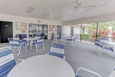 Rare First-Floor 3-Bedroom Corner Condo with Golf Course Views - on University Park Country Club in Florida - for sale on GolfHomes.com, golf home, golf lot