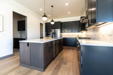 Welcome to your dream home! Nestled along the scenic 11th hole on The Golf Club At Redlands Mesa in Colorado - for sale on GolfHomes.com, golf home, golf lot