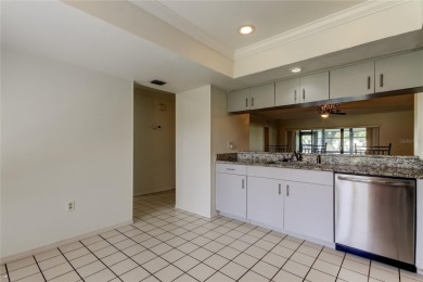 Welcome to El Pasado Condominiums, a quiet, well-maintained on Tarpon Woods Golf Club in Florida - for sale on GolfHomes.com, golf home, golf lot
