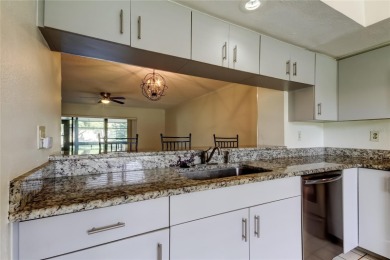 Welcome to El Pasado Condominiums, a quiet, well-maintained on Tarpon Woods Golf Club in Florida - for sale on GolfHomes.com, golf home, golf lot