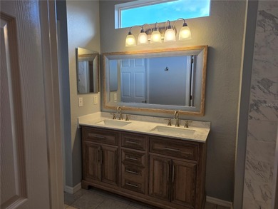 This 2-bedroom, 2-bath Amelia model home in Del Webb Spruce on Eagle Ridge At Spruce Creek Country Club in Florida - for sale on GolfHomes.com, golf home, golf lot