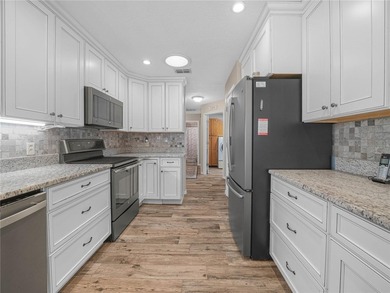 Discover the charm and elegance of this beautifully updated home on Sandpiper Golf Club in Florida - for sale on GolfHomes.com, golf home, golf lot