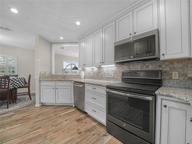 Discover the charm and elegance of this beautifully updated home on Sandpiper Golf Club in Florida - for sale on GolfHomes.com, golf home, golf lot