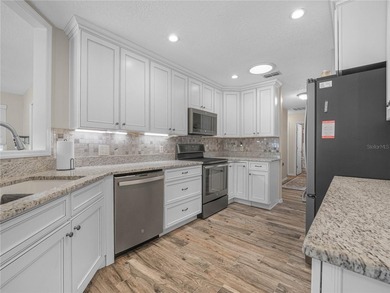 Discover the charm and elegance of this beautifully updated home on Sandpiper Golf Club in Florida - for sale on GolfHomes.com, golf home, golf lot