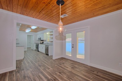 This 2 story beauty backs up to the national forest and is a 3 on Pendleton Harbor in Texas - for sale on GolfHomes.com, golf home, golf lot