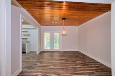 This 2 story beauty backs up to the national forest and is a 3 on Pendleton Harbor in Texas - for sale on GolfHomes.com, golf home, golf lot