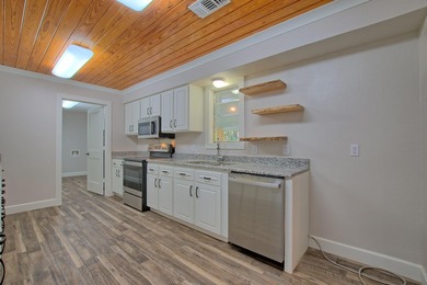 This 2 story beauty backs up to the national forest and is a 3 on Pendleton Harbor in Texas - for sale on GolfHomes.com, golf home, golf lot