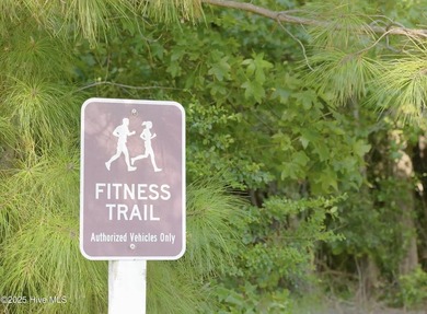 Situated on the golf course in Beaufort Club, 111 Windswept Lane on North River Club in North Carolina - for sale on GolfHomes.com, golf home, golf lot