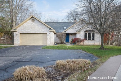 Welcome to 2202 Burton Pointe a lovely all-brick walkout ranch on Watermark Country Club in Michigan - for sale on GolfHomes.com, golf home, golf lot