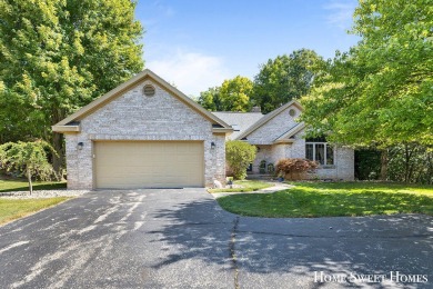 Welcome to 2202 Burton Pointe a lovely all-brick walkout ranch on Watermark Country Club in Michigan - for sale on GolfHomes.com, golf home, golf lot