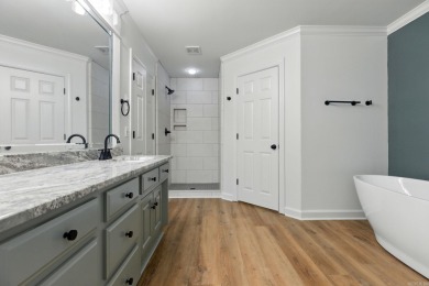This traditional home located on a quiet street in the Country on The Country Club of Arkansas in Arkansas - for sale on GolfHomes.com, golf home, golf lot