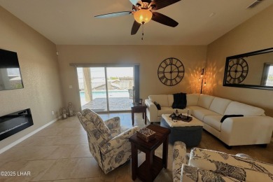 A Stunning RV Garage Pool Home in Lake Havasu City. Nestled on a on London Bridge Golf Course in Arizona - for sale on GolfHomes.com, golf home, golf lot