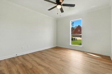 This traditional home located on a quiet street in the Country on The Country Club of Arkansas in Arkansas - for sale on GolfHomes.com, golf home, golf lot