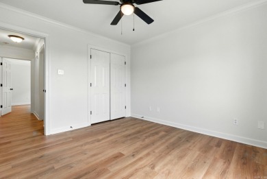 This traditional home located on a quiet street in the Country on The Country Club of Arkansas in Arkansas - for sale on GolfHomes.com, golf home, golf lot