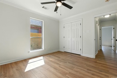 This traditional home located on a quiet street in the Country on The Country Club of Arkansas in Arkansas - for sale on GolfHomes.com, golf home, golf lot