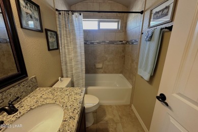 A Stunning RV Garage Pool Home in Lake Havasu City. Nestled on a on London Bridge Golf Course in Arizona - for sale on GolfHomes.com, golf home, golf lot