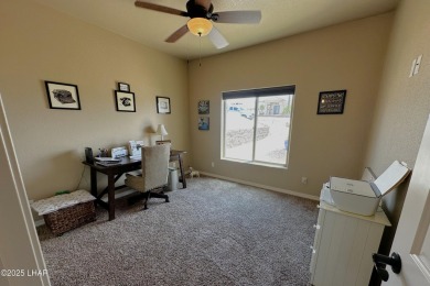 A Stunning RV Garage Pool Home in Lake Havasu City. Nestled on a on London Bridge Golf Course in Arizona - for sale on GolfHomes.com, golf home, golf lot
