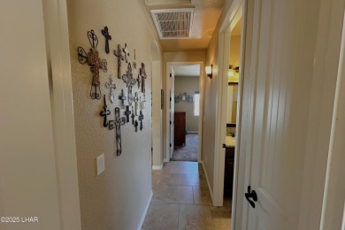 A Stunning RV Garage Pool Home in Lake Havasu City. Nestled on a on London Bridge Golf Course in Arizona - for sale on GolfHomes.com, golf home, golf lot