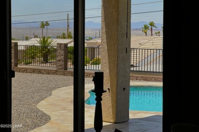 A Stunning RV Garage Pool Home in Lake Havasu City. Nestled on a on London Bridge Golf Course in Arizona - for sale on GolfHomes.com, golf home, golf lot