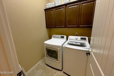 A Stunning RV Garage Pool Home in Lake Havasu City. Nestled on a on London Bridge Golf Course in Arizona - for sale on GolfHomes.com, golf home, golf lot