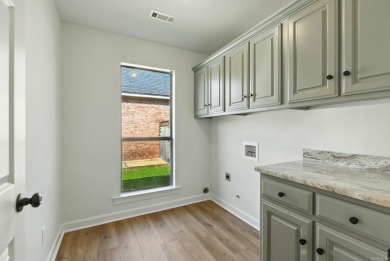This traditional home located on a quiet street in the Country on The Country Club of Arkansas in Arkansas - for sale on GolfHomes.com, golf home, golf lot