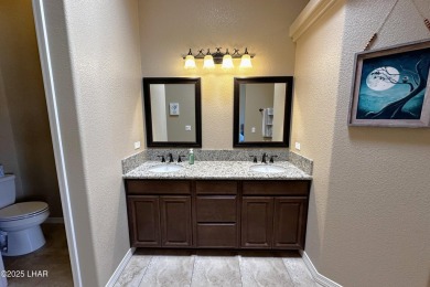 A Stunning RV Garage Pool Home in Lake Havasu City. Nestled on a on London Bridge Golf Course in Arizona - for sale on GolfHomes.com, golf home, golf lot