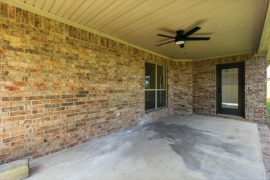 This traditional home located on a quiet street in the Country on The Country Club of Arkansas in Arkansas - for sale on GolfHomes.com, golf home, golf lot
