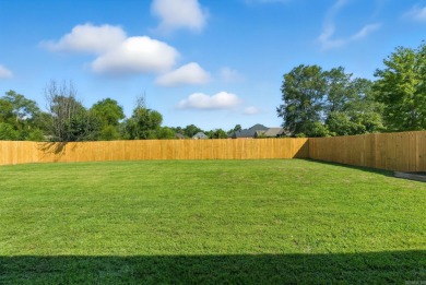 This traditional home located on a quiet street in the Country on The Country Club of Arkansas in Arkansas - for sale on GolfHomes.com, golf home, golf lot