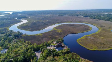 This golf course lot looks down the first fairway of the Ibis on Carolina National Golf Club in North Carolina - for sale on GolfHomes.com, golf home, golf lot