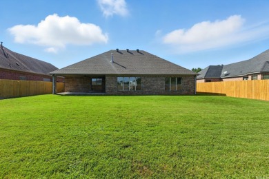 This traditional home located on a quiet street in the Country on The Country Club of Arkansas in Arkansas - for sale on GolfHomes.com, golf home, golf lot