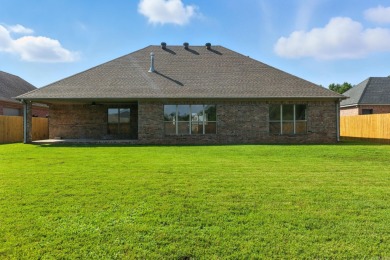 This traditional home located on a quiet street in the Country on The Country Club of Arkansas in Arkansas - for sale on GolfHomes.com, golf home, golf lot
