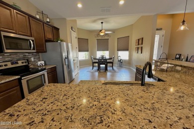A Stunning RV Garage Pool Home in Lake Havasu City. Nestled on a on London Bridge Golf Course in Arizona - for sale on GolfHomes.com, golf home, golf lot