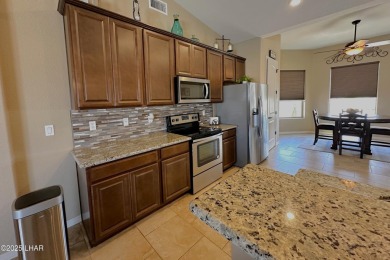 A Stunning RV Garage Pool Home in Lake Havasu City. Nestled on a on London Bridge Golf Course in Arizona - for sale on GolfHomes.com, golf home, golf lot