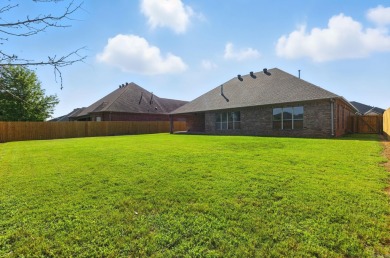 This traditional home located on a quiet street in the Country on The Country Club of Arkansas in Arkansas - for sale on GolfHomes.com, golf home, golf lot