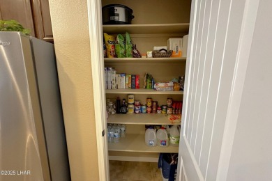 A Stunning RV Garage Pool Home in Lake Havasu City. Nestled on a on London Bridge Golf Course in Arizona - for sale on GolfHomes.com, golf home, golf lot