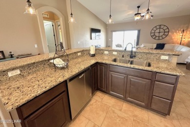 A Stunning RV Garage Pool Home in Lake Havasu City. Nestled on a on London Bridge Golf Course in Arizona - for sale on GolfHomes.com, golf home, golf lot