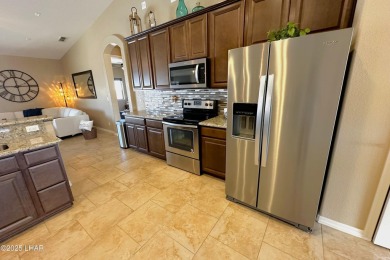A Stunning RV Garage Pool Home in Lake Havasu City. Nestled on a on London Bridge Golf Course in Arizona - for sale on GolfHomes.com, golf home, golf lot