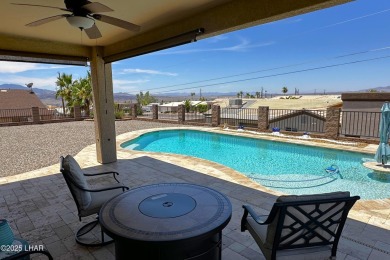 A Stunning RV Garage Pool Home in Lake Havasu City. Nestled on a on London Bridge Golf Course in Arizona - for sale on GolfHomes.com, golf home, golf lot