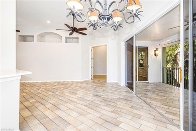 Step into a home that feels equal parts refined and on West Bay Beach and Golf Club in Florida - for sale on GolfHomes.com, golf home, golf lot