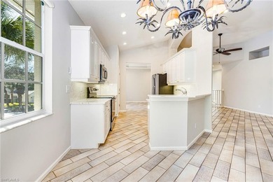 Step into a home that feels equal parts refined and on West Bay Beach and Golf Club in Florida - for sale on GolfHomes.com, golf home, golf lot