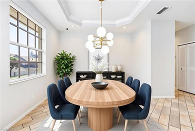 Step into a home that feels equal parts refined and on West Bay Beach and Golf Club in Florida - for sale on GolfHomes.com, golf home, golf lot