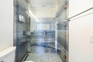 Step into a home that feels equal parts refined and on West Bay Beach and Golf Club in Florida - for sale on GolfHomes.com, golf home, golf lot