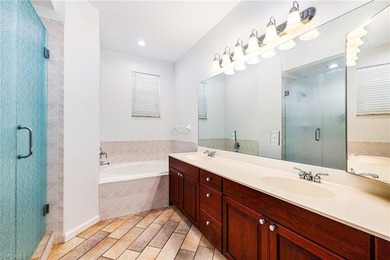 Step into a home that feels equal parts refined and on West Bay Beach and Golf Club in Florida - for sale on GolfHomes.com, golf home, golf lot