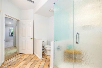 Step into a home that feels equal parts refined and on West Bay Beach and Golf Club in Florida - for sale on GolfHomes.com, golf home, golf lot