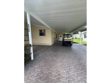 Welcome to this beautifully maintained 2/2 home where you will on Lake Henry Golf Club in Florida - for sale on GolfHomes.com, golf home, golf lot