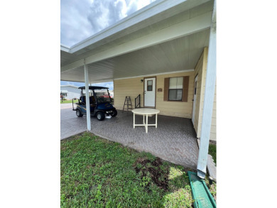 Welcome to this beautifully maintained 2/2 home where you will on Lake Henry Golf Club in Florida - for sale on GolfHomes.com, golf home, golf lot