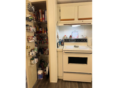 Welcome to this beautifully maintained 2/2 home where you will on Lake Henry Golf Club in Florida - for sale on GolfHomes.com, golf home, golf lot