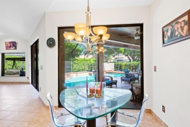 Exceptional 6BR/3-2hb stunning residence nestled on a corner lot on TPC Eagle Trace in Florida - for sale on GolfHomes.com, golf home, golf lot